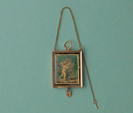 Early 19th Century 18ct Gold Angel Locket; black and gold ‘verre eglomisé’ angel picking roses, miniature key and lock, French gold mark for 1809-1819