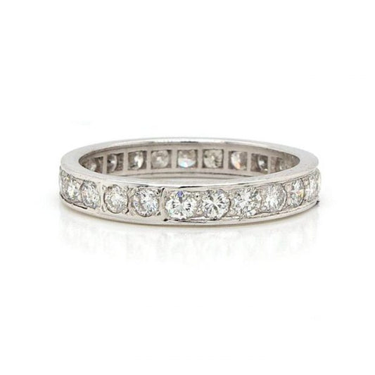 1.30ct Diamond Full Eternity Ring; A platinum full eternity ring channel-set with round brilliant cut diamonds totalling 1.30 carats. Finger size: N
