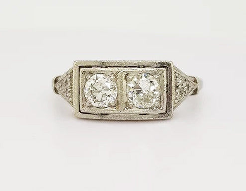 Art Deco Diamond Plaque Ring; This striking ring features two brilliant cut diamonds, claw set, and mounted in platinum. A classic geometric design.