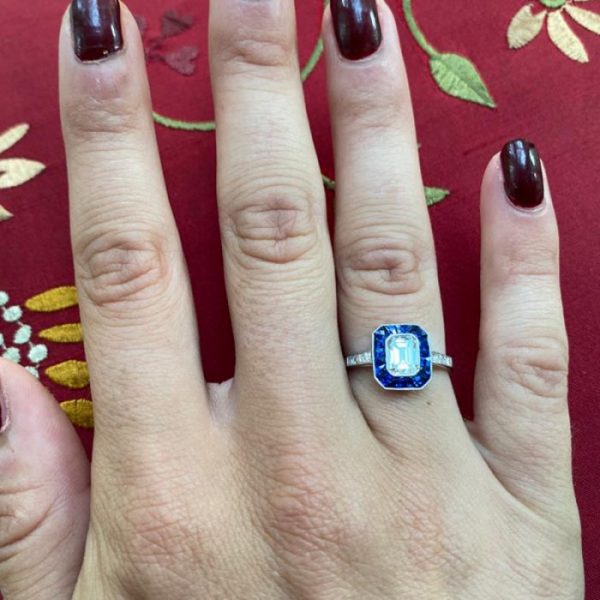 0.69ct Emerald Cut Diamond and Sapphire Cluster Ring, E VS2, Square-cut diamond set shoulders, mounted in platinum