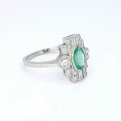 Art Deco Style Emerald and Diamond Plaque Ring; 0.77ct oval emerald surrounded by 0.60cts baguette and round cut diamonds, in 18ct white gold