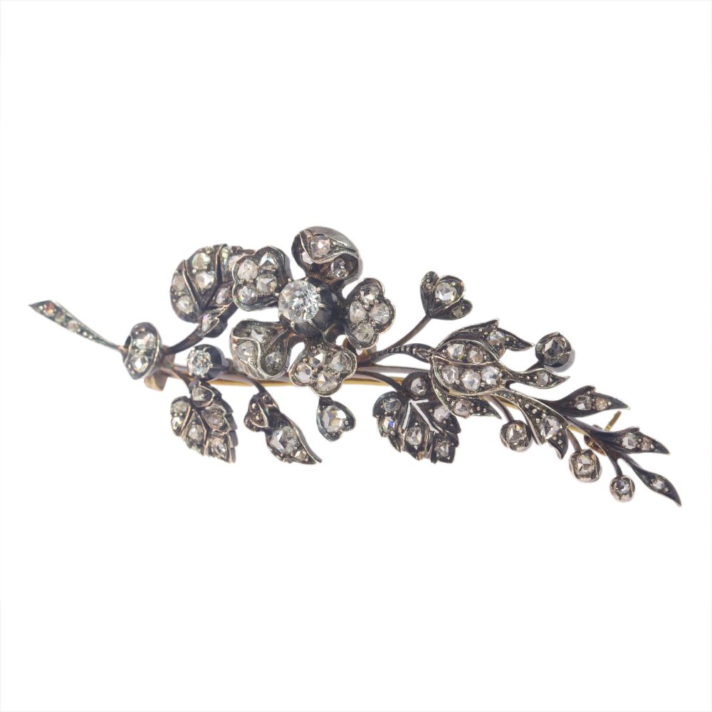 Victorian diamond flower brooch in gold and silver.