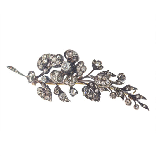 Victorian diamond flower brooch in gold and silver.
