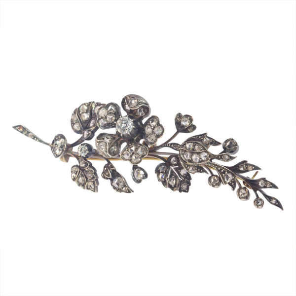 Victorian diamond flower brooch in gold and silver.
