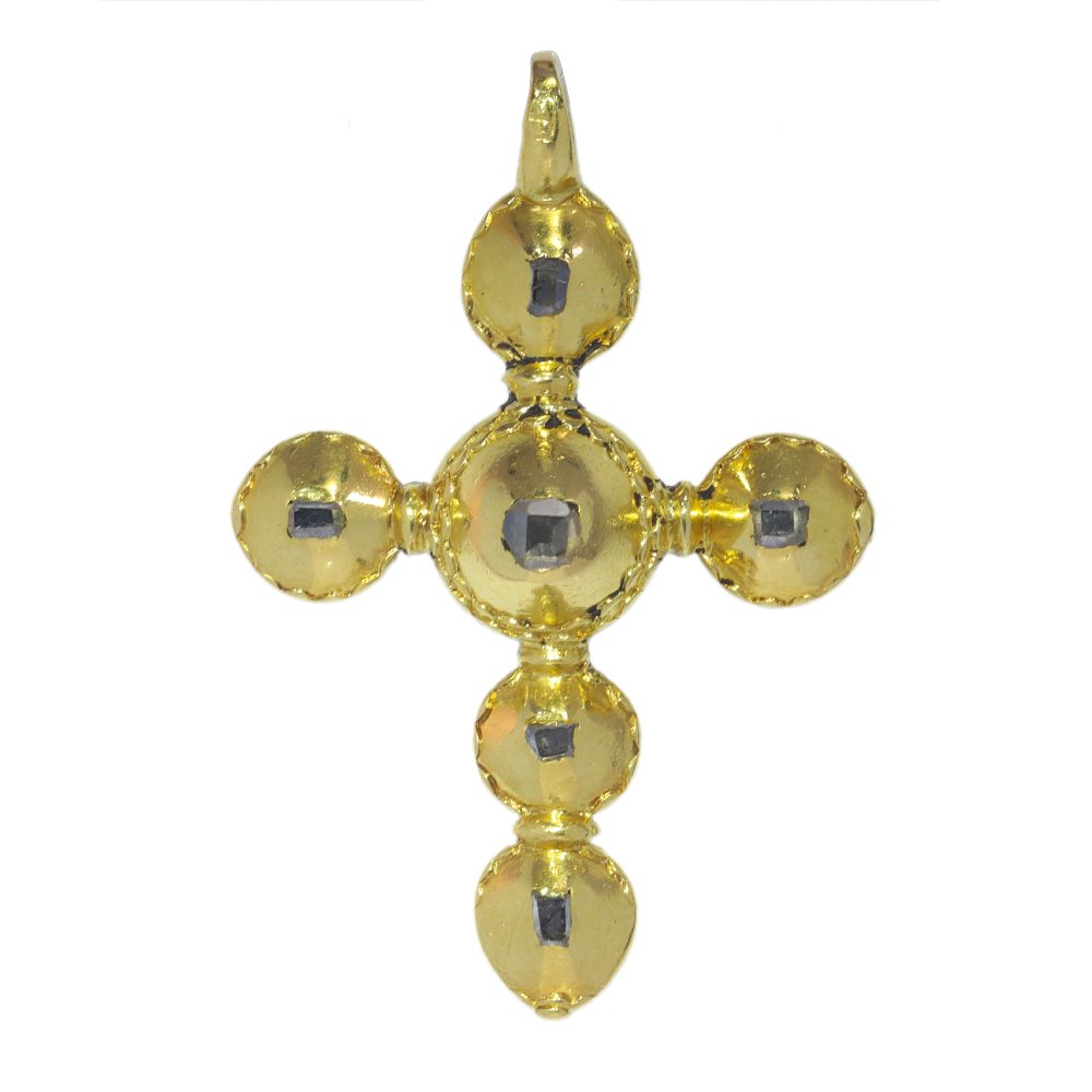 Baroque diamond cross pendant in gold.