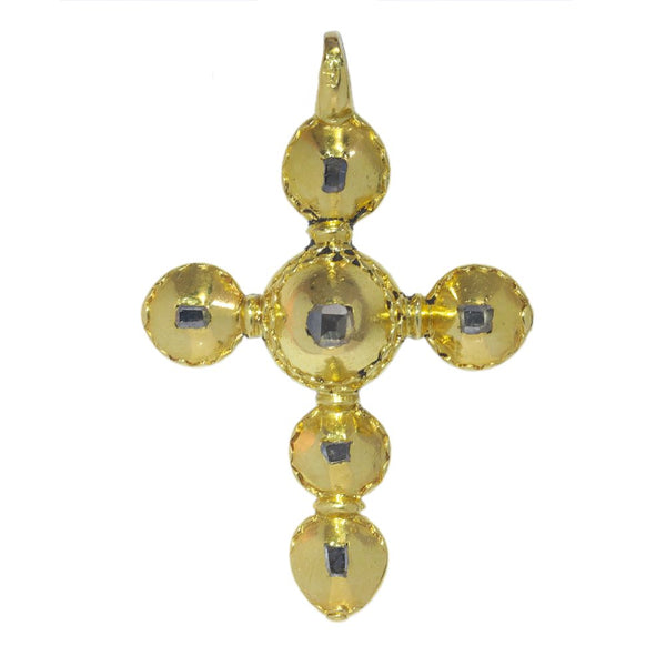 Baroque diamond cross pendant in gold.