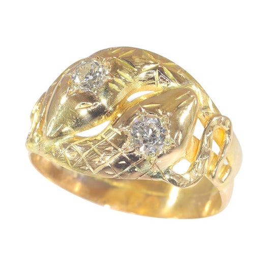 Antique serpent diamond ring in gold.
