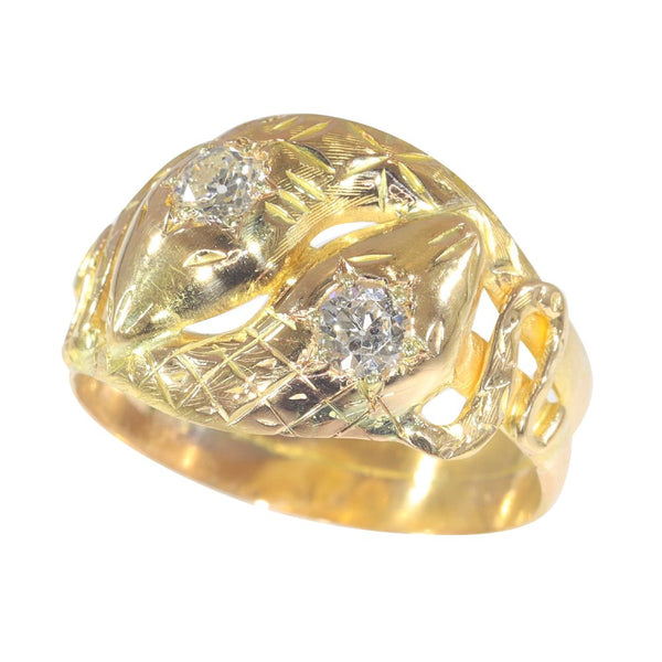 Antique serpent diamond ring in gold.