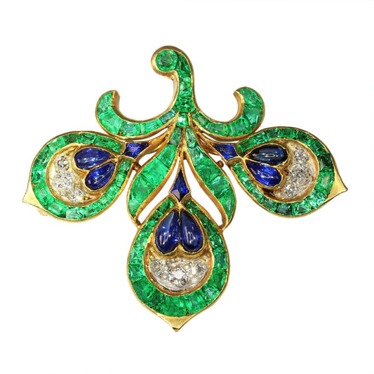Antique French Emerald Sapphire Diamond Fleur de Lis Brooch, outlined with precision-cut intense green emeralds, accented with blue sapphires and sparkling diamonds. Mounted in 18ct yellow gold. Late 19th century Circa 1890