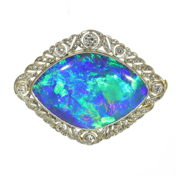 Antique 24 carat Black Opal brooch surrounded by 68 diamonds set in 18 carat gold.