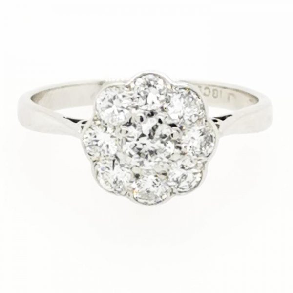 Antique Edwardian Diamond Floral Cluster Ring; central Old European cut diamond surrounded by eight further diamonds, in 18ct white gold