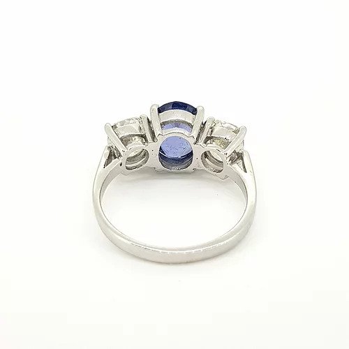Madagascan Sapphire and Diamond Three Stone Trilogy Ring; central 2.52ct oval faceted Madagascan sapphire flanked by 2.00cts circular cut diamonds