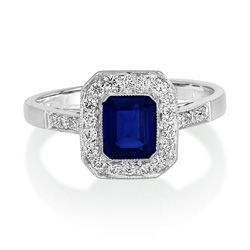 1ct Sapphire and Diamond Cluster Engagement Ring, emerald/octagonal shaped step-cut 1.02ct sapphire within a border of sparkling round brilliant-cut diamonds in 18ct white gold