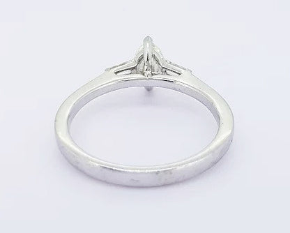 Marquise Cut Diamond Engagement Ring; set with a 0.45ct marquise-cut diamond flanked by 0.13ct baguette-cut diamond set shoulders, 18ct white gold.