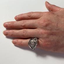 Retro Diamond and Platinum Cocktail Ring; designed as a dome with curved and flaring ridges, set with 2.55 carats round brilliant cut and baguette diamonds