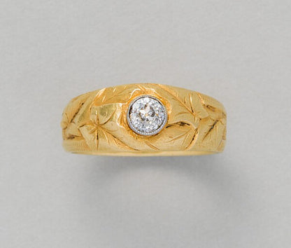 Art Nouveau Diamond Set 18ct Gold Ivy Ring; French 18ct yellow gold ring with engravings of ivy leaves set with a central diamond, Circa 1900-1910