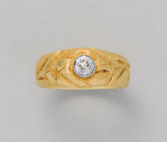 Art Nouveau Diamond Set 18ct Gold Ivy Ring; French 18ct yellow gold ring with engravings of ivy leaves set with a central diamond, Circa 1900-1910