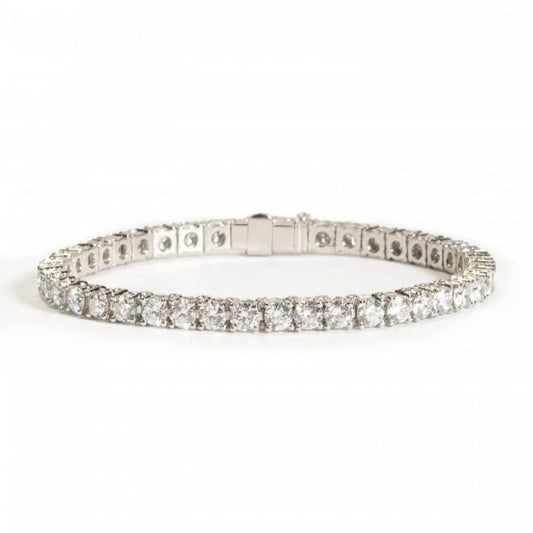 Diamond Line Bracelet in Platinum, forty-one round brilliant-cut diamonds totalling 9.90 carats, each in individually hinged four-claw basket settings