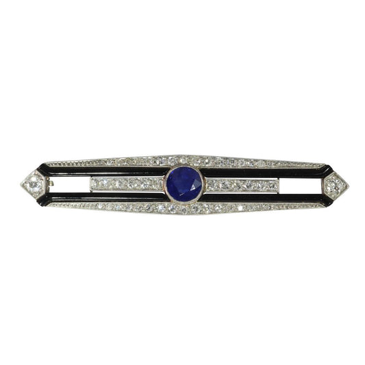 Art Deco diamond, sapphire and onyx bar brooch in white gold.