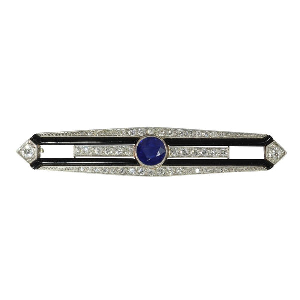 Art Deco diamond, sapphire and onyx bar brooch in white gold.