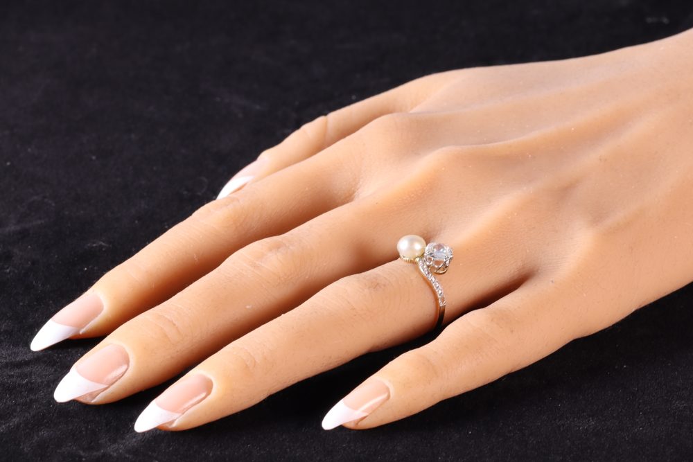 An Old Cut Diamond And Pearl Toi et Moi Ring In 18 Carat Yellow Gold And Platinum