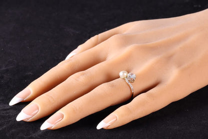 An Old Cut Diamond And Pearl Toi et Moi Ring In 18 Carat Yellow Gold And Platinum