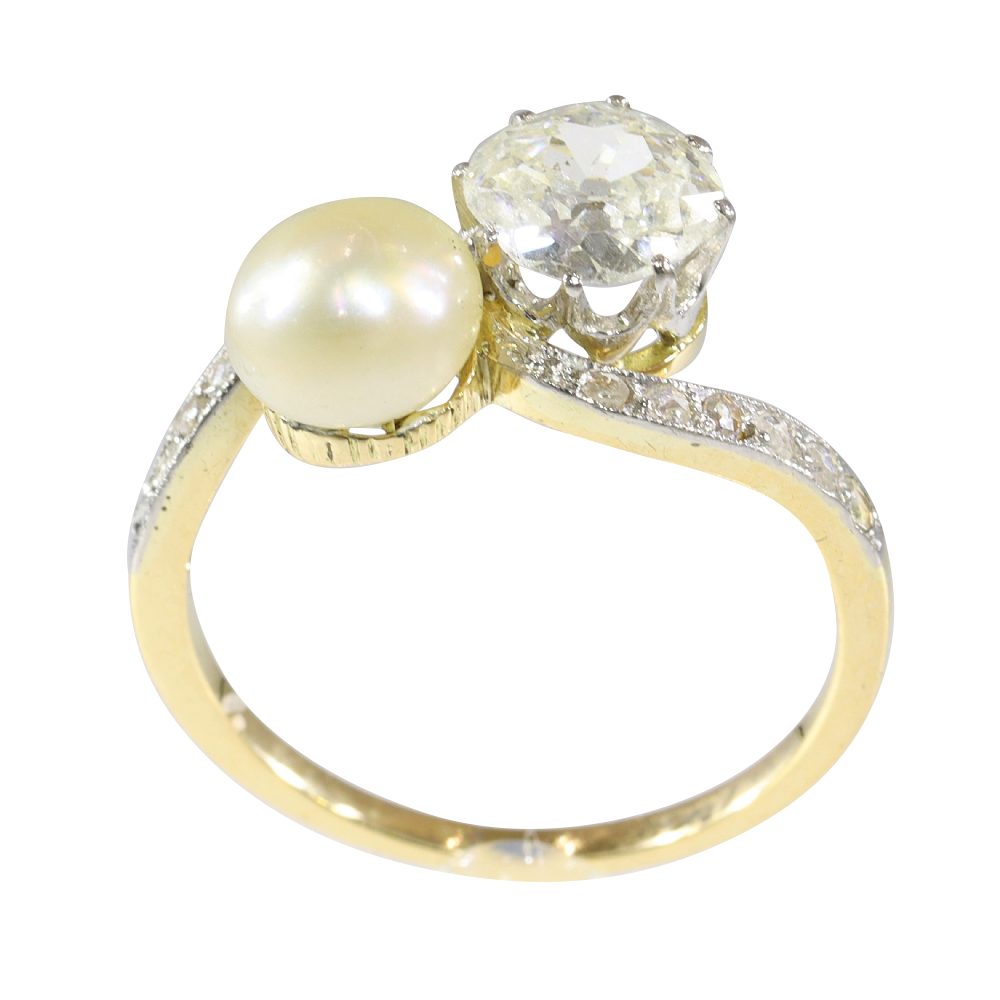 An Old Cut Diamond And Pearl Toi et Moi Ring In 18 Carat Yellow Gold And Platinum