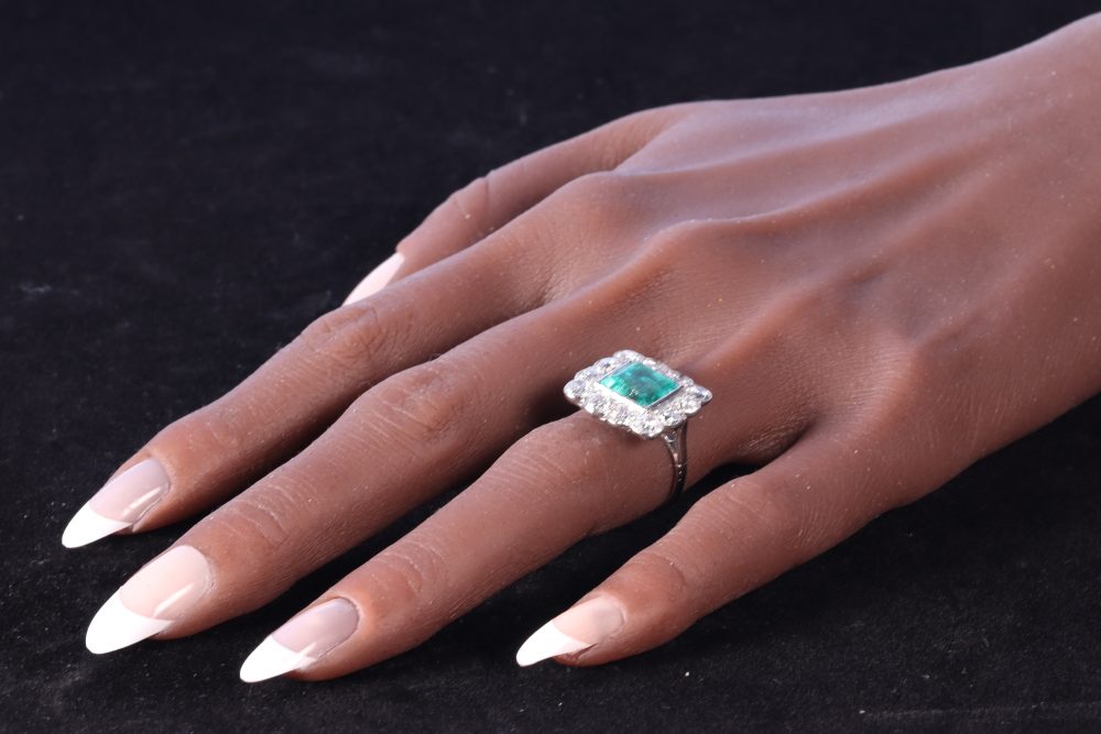 emerald ring on finger