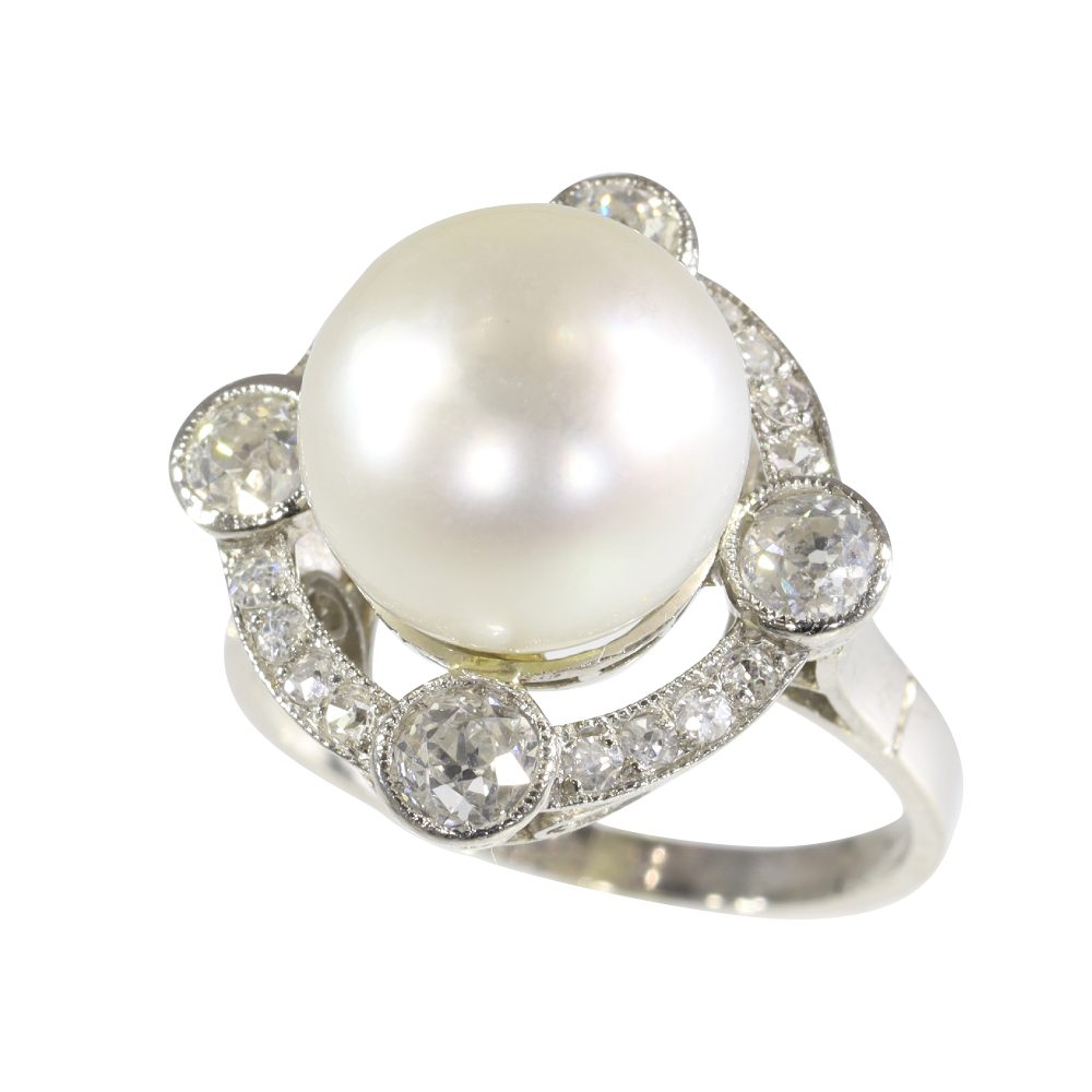 Art Deco pearl and old cut diamond ring in platinum.