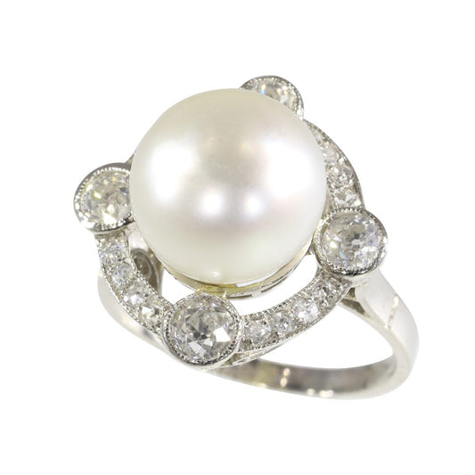 Art Deco pearl and old cut diamond ring in platinum.