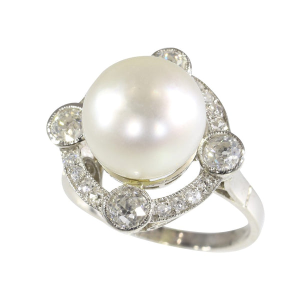 Art Deco pearl and old cut diamond ring in platinum.
