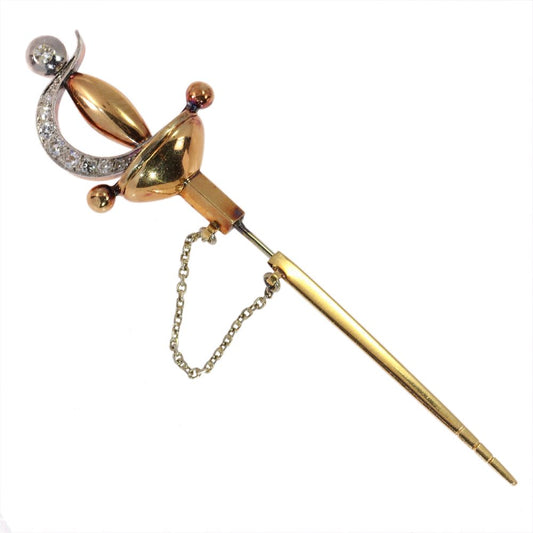 Vintage diamond sword brooch in yellow gold.