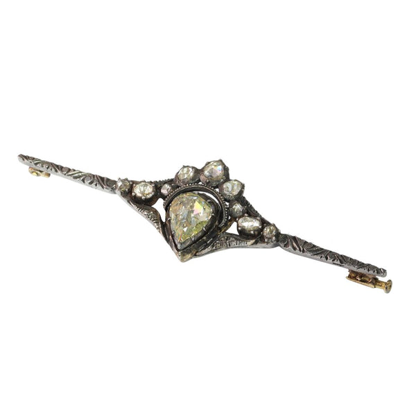 Diamond bar brooch in gold and silver.
