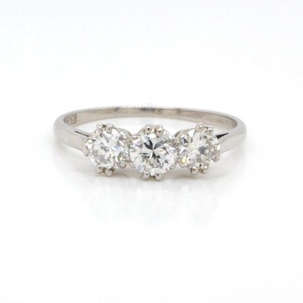 Vintage Diamond and Platinum Three Stone Ring; diamond trilogy ring, 0.85cts brilliant cut diamonds all claw-set to a plain platinum shank
