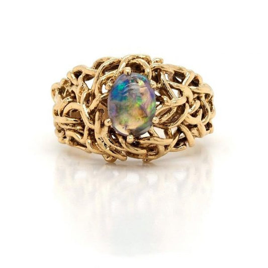 Vintage Ornate 18ct Yellow Gold and Black Opal Dress Ring; ornate openwork 18ct yellow gold mount and shank claw-set with a single oval cabochon black opal, Circa 1960