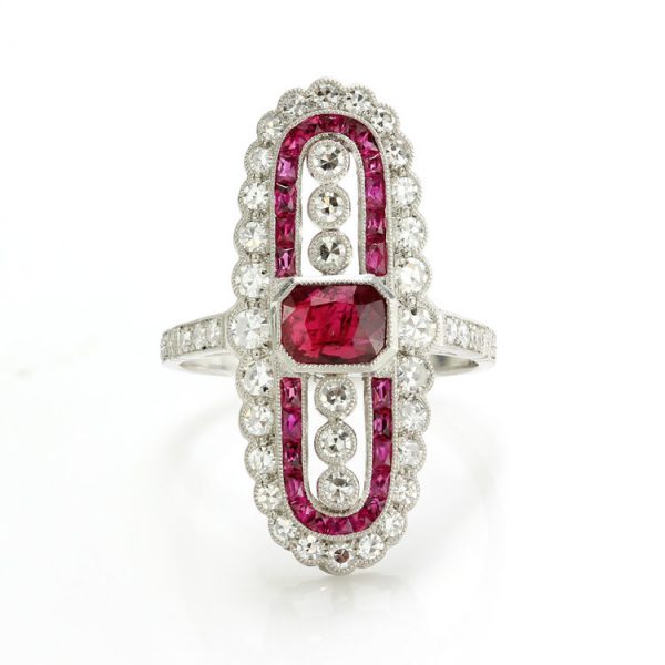 Vintage Art Deco Style Ruby and Diamond Cluster Plaque Ring; central octagonal-cut ruby framed by calibre-cut rubies, accented by 0.92 carats of round brilliant-cut diamonds, in platinum, Circa 1980s