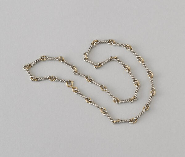 Chaumet Vintage 18ct Yellow Gold and Silver Chain; gold round links alternated with twisted silver links. Signed and numbered, Circa 1970