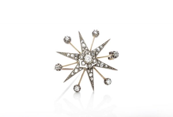 Antique Victorian Old Cut Diamond Star Brooch; set with rose cut and old European cut diamonds, 0.88 carat total, set in silver and 15ct gold