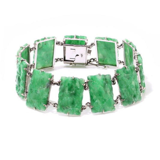 Vintage Jadeite Jade Panel Bracelet; comprised of carved panels of jade with 9ct white gold, Circa 1970s