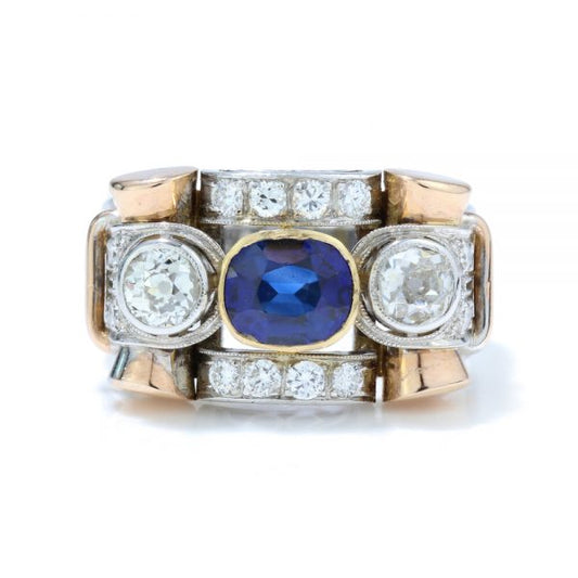 Vintage Sapphire and Old Cut Diamond Dress Ring; central sapphire and old cut diamond three stone ring section within a diamond-set geometric surround, in 18ct white and yellow gold