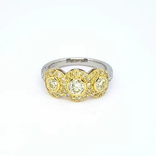 Fancy Yellow Diamond Triple Cluster Ring; three fancy yellow diamonds surrounded by a border of yellow diamonds, set in yellow gold, mounted to a platinum shank with diamond set shoulders, 1.22 carats
