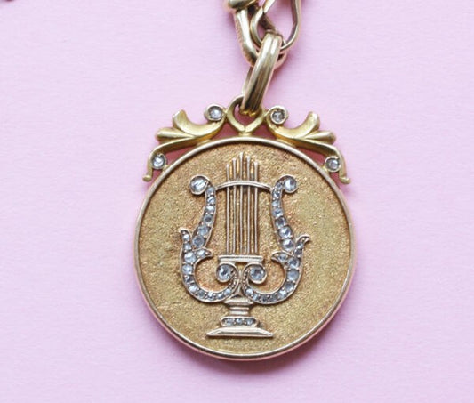 Art Nouveau Rose Cut Diamond Gold Lyre Locket Pendant; decorated with a lyre in rose cut diamonds, in original case. American, Circa 1900
