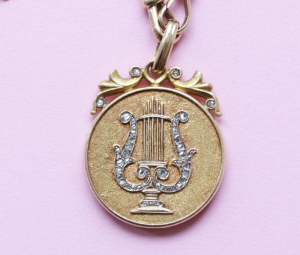 Art Nouveau Rose Cut Diamond Gold Lyre Locket Pendant; decorated with a lyre in rose cut diamonds, in original case. American, Circa 1900