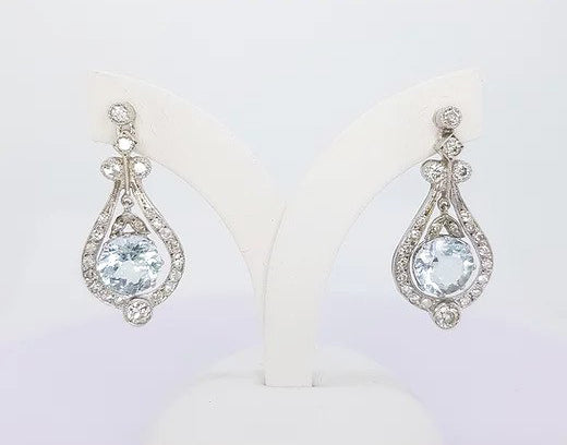 Art Deco Style 4ct Aquamarine and Diamond Drop Earrings; 4cts aquamarines surrounded by brilliant cut diamonds totaling 1ct, 18ct white gold