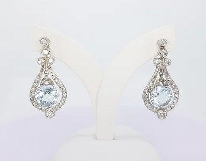 Art Deco Style 4ct Aquamarine and Diamond Drop Earrings; 4cts aquamarines surrounded by brilliant cut diamonds totaling 1ct, 18ct white gold