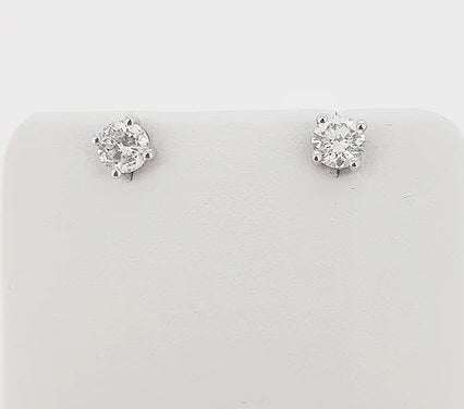 0.91ct Diamond Stud Earrings; round brilliant-cut diamonds, four-claw set, in 18ct white gold. Total diamond weight: 0.91 carats.