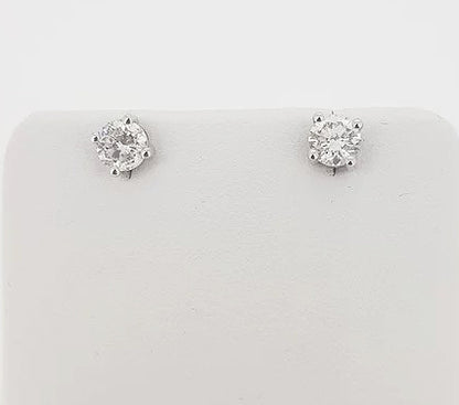 0.91ct Diamond Stud Earrings; round brilliant-cut diamonds, four-claw set, in 18ct white gold. Total diamond weight: 0.91 carats.