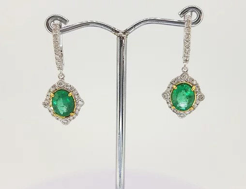 Emerald and Diamond Cluster Drop Earrings; 2.21cts oval emeralds surrounded by brilliant diamonds, suspended from diamond set hoop, 18ct gold