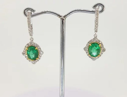 Emerald and Diamond Cluster Drop Earrings; 2.21cts oval emeralds surrounded by brilliant diamonds, suspended from diamond set hoop, 18ct gold