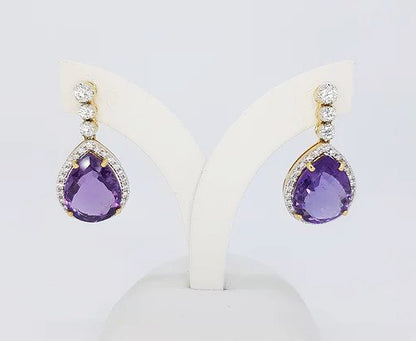 Amethyst and Diamond Drop Earrings; pear-shaped rose-cut amethysts, surrounded by diamonds, graduated diamond set drop, 18ct yellow gold.